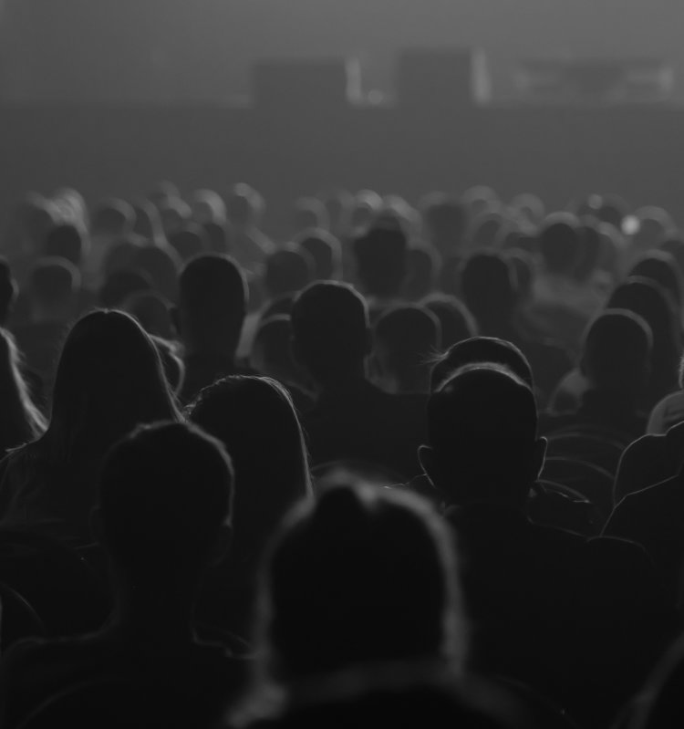 Unrecognizable people listening to speaker during business conference